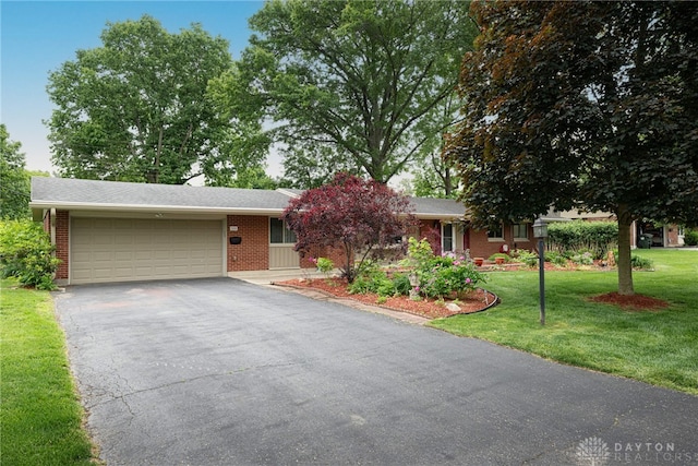 2444 Tennyson Dr, Bellbrook, OH 45305 - single story home featuring a garage, a front lawn, asphalt driveway, and brick siding