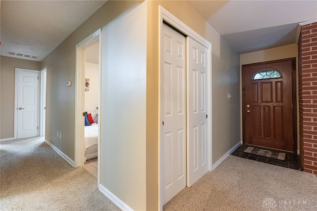 2444 Tennyson Dr, Bellbrook, OH 45305 - carpeted entryway featuring baseboards and a textured ceiling