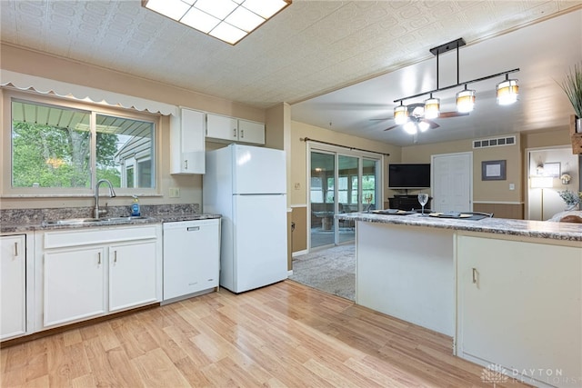 2444 Tennyson Dr, Bellbrook, OH 45305 - kitchen featuring white appliances, a sink, light wood-type flooring, white cabinets, and a ceiling fan