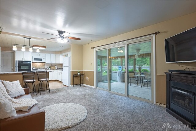2444 Tennyson Dr, Bellbrook, OH 45305 - living room featuring a ceiling fan and light colored carpet