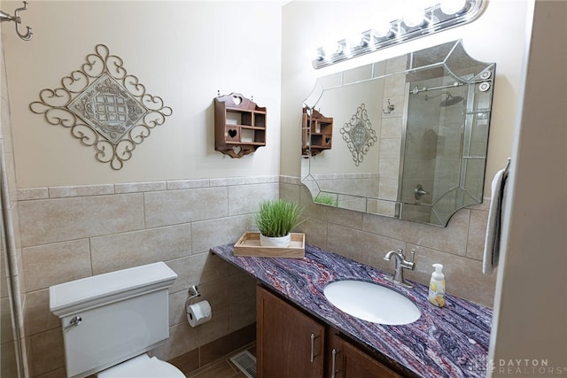 2444 Tennyson Dr, Bellbrook, OH 45305 - bathroom featuring toilet, vanity, a shower stall, and tile walls