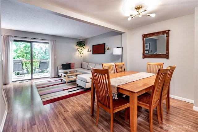 9492 Colegate Way, West Chester, OH 45011 - dining space with a chandelier, wood finished floors, and baseboards