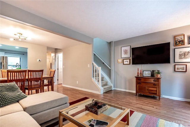 9492 Colegate Way, West Chester, OH 45011 - living room featuring wood finished floors, stairs, and baseboards