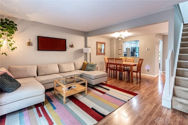 9492 Colegate Way, West Chester, OH 45011 - living area featuring stairway, wood finished floors, and baseboards