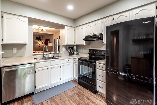 9492 Colegate Way, West Chester, OH 45011 - kitchen with black appliances, a sink, under cabinet range hood, white cabinetry, and recessed lighting