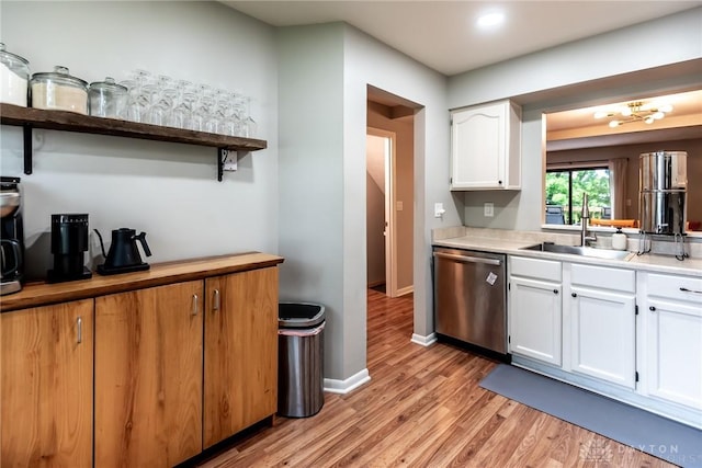 9492 Colegate Way, West Chester, OH 45011 - kitchen featuring stainless steel dishwasher, open shelves, a sink, white cabinetry, and light wood-style floors