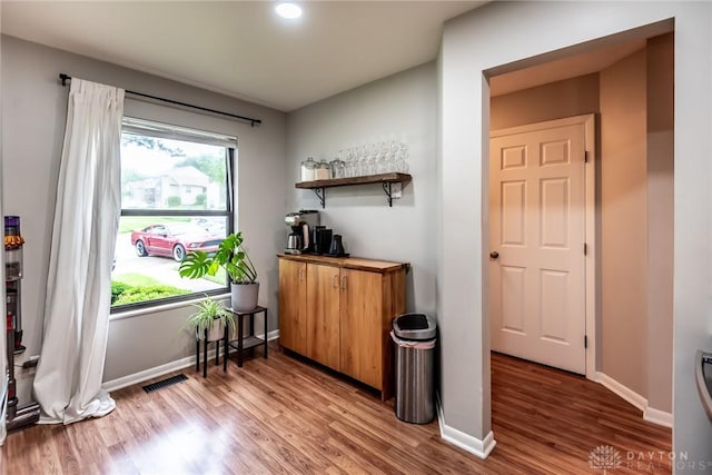 9492 Colegate Way, West Chester, OH 45011 - bar area with light wood finished floors, baseboards, and recessed lighting