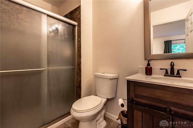 9492 Colegate Way, West Chester, OH 45011 - full bath with vanity, toilet, a shower stall, baseboards, and tile patterned flooring