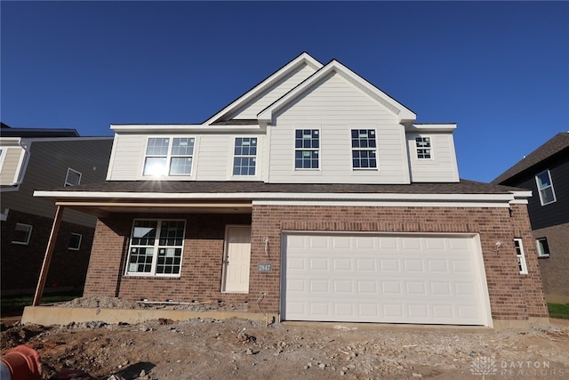 2847 Sky Crossing Dr Unit 0048, Beavercreek, OH 45434 - traditional home with brick siding, a garage, and driveway