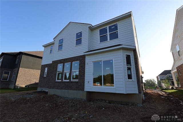 2847 Sky Crossing Dr Unit 0048, Beavercreek, OH 45434 - rear view of house featuring brick siding