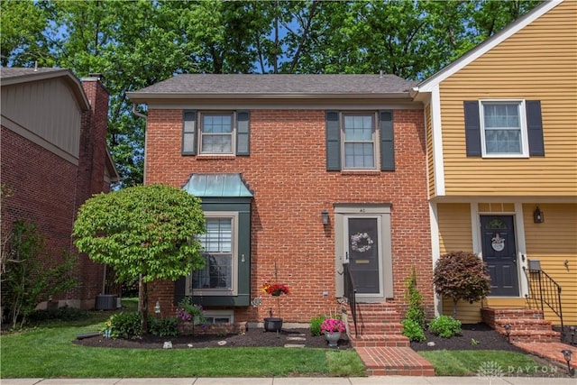 40 Nicholson Ct, Washington Twp, OH 45459 - view of front of home with entry steps, brick siding, central AC, and roof with shingles