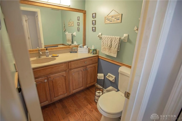 40 Nicholson Ct, Washington Twp, OH 45459 - half bathroom with toilet, wood finished floors, and vanity