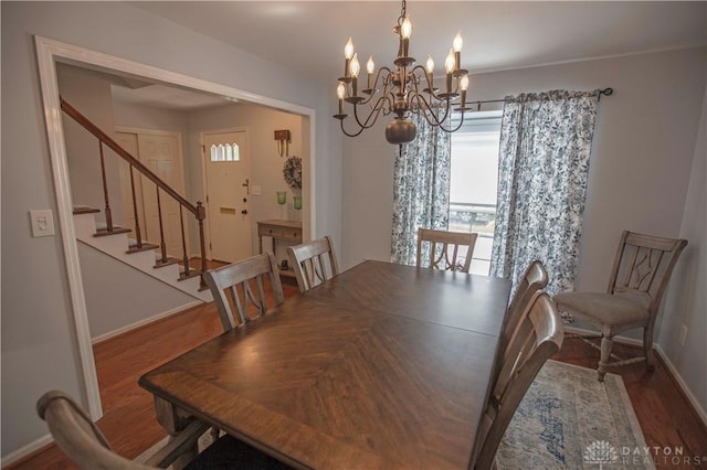 40 Nicholson Ct, Washington Twp, OH 45459 - dining area with a chandelier, stairs, baseboards, and wood finished floors