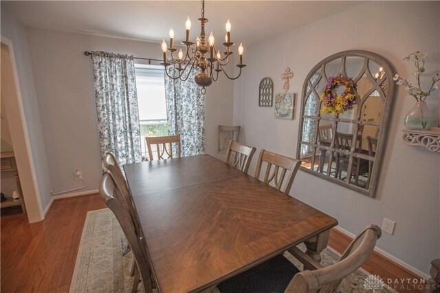 40 Nicholson Ct, Washington Twp, OH 45459 - dining space with a chandelier, wood finished floors, and baseboards
