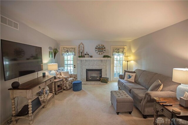 40 Nicholson Ct, Washington Twp, OH 45459 - carpeted living area featuring a fireplace