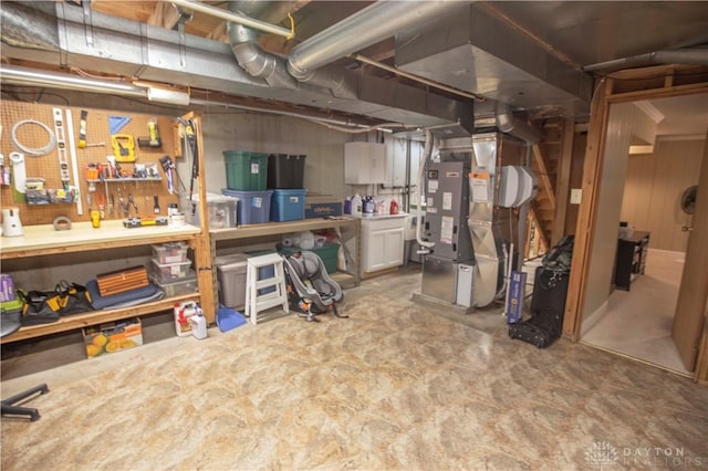 40 Nicholson Ct, Washington Twp, OH 45459 - unfinished below grade area with a workshop area and heating unit