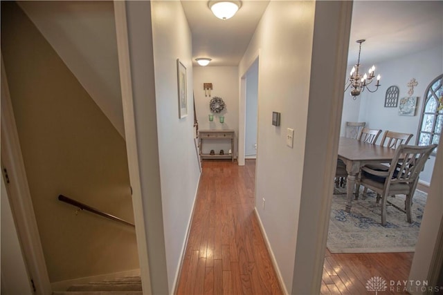 40 Nicholson Ct, Washington Twp, OH 45459 - hall featuring wood-type flooring, a chandelier, and baseboards