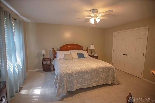 40 Nicholson Ct, Washington Twp, OH 45459 - bedroom with light colored carpet, baseboards, a ceiling fan, and a closet