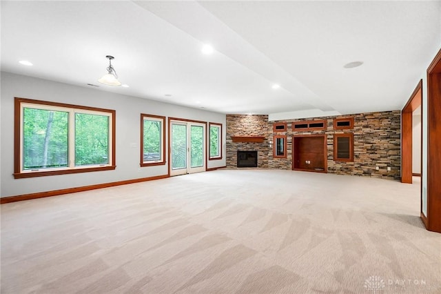 7721 Country Brook Ct, Springboro, OH 45066 - unfurnished living room with a stone fireplace, light carpet, recessed lighting, baseboards, and beam ceiling