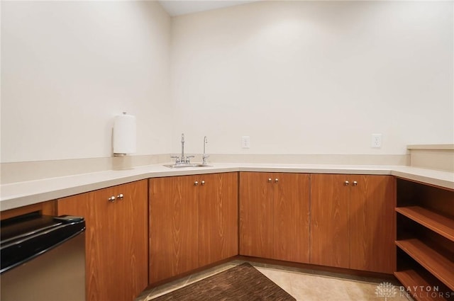 7721 Country Brook Ct, Springboro, OH 45066 - kitchen with a sink, light countertops, open shelves, dishwasher, and brown cabinetry