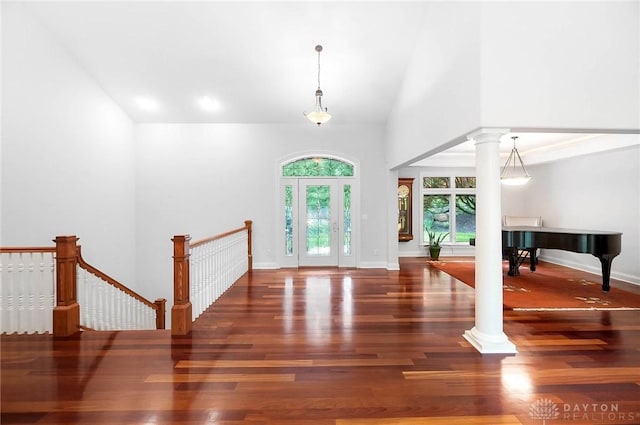 7721 Country Brook Ct, Springboro, OH 45066 - foyer entrance with ornate columns, wood finished floors, high vaulted ceiling, and baseboards