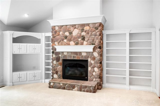 7721 Country Brook Ct, Springboro, OH 45066 - unfurnished living room featuring a stone fireplace, vaulted ceiling, and built in shelves
