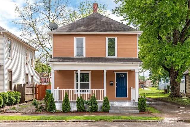 1015 Maiden Ln, Springfield, OH 45504 - view of front of home with a porch, a chimney, and roof with shingles