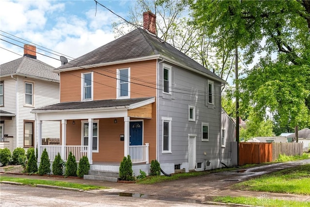 1015 Maiden Ln, Springfield, OH 45504 - view of front of home featuring covered porch, a chimney, and a shingled roof