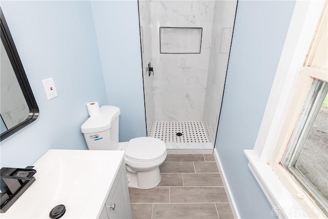 1015 Maiden Ln, Springfield, OH 45504 - full bathroom featuring a marble finish shower, toilet, vanity, and wood finish floors