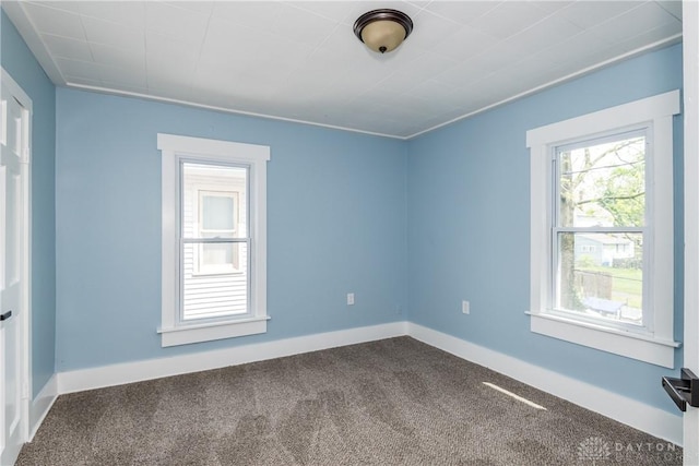 1015 Maiden Ln, Springfield, OH 45504 - unfurnished room with dark colored carpet and baseboards