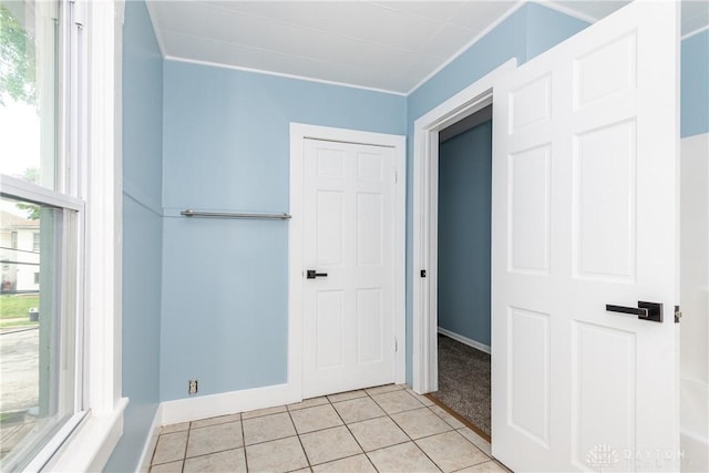 1015 Maiden Ln, Springfield, OH 45504 - unfurnished bedroom with light tile patterned floors and baseboards