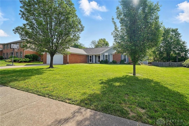 601 Tara Oaks Dr, Middletown, OH 45042 - view of front facade featuring an attached garage, brick siding, and concrete driveway