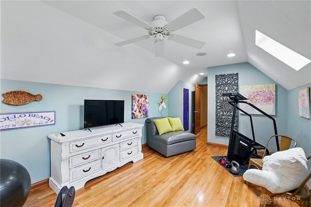 1129 Green Tree Rd, Centerville, OH 45429 - exercise room featuring a skylight, light wood-style floors, vaulted ceiling, ceiling fan, and baseboards