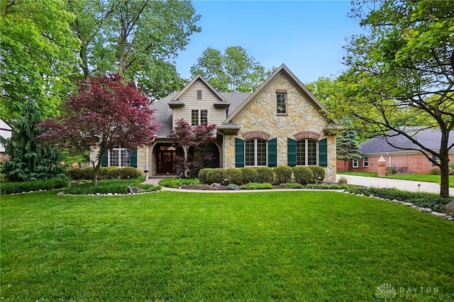 1129 Green Tree Rd, Centerville, OH 45429 - view of front facade with stone siding and a front yard