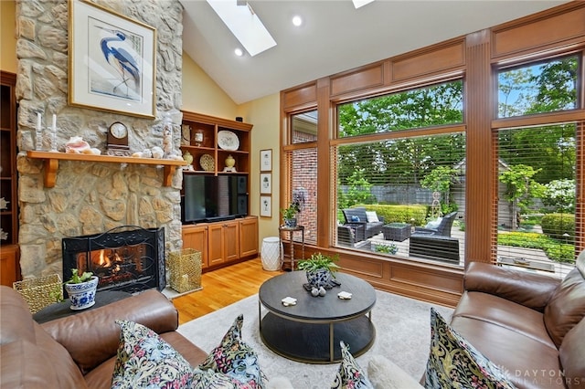 1129 Green Tree Rd, Centerville, OH 45429 - living area with a fireplace, healthy amount of natural light, light wood-type flooring, high vaulted ceiling, and recessed lighting
