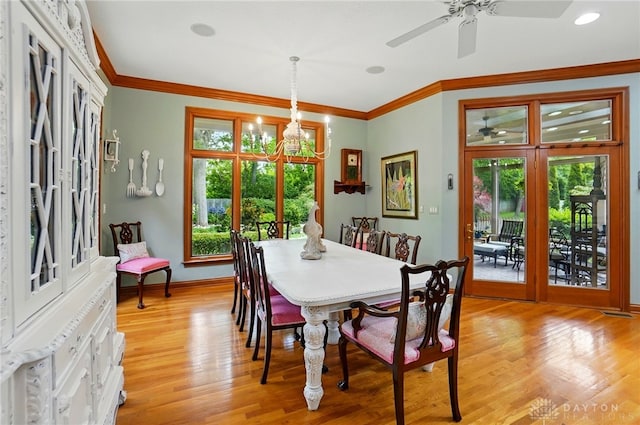 1129 Green Tree Rd, Centerville, OH 45429 - dining area with light wood-style flooring, ceiling fan, baseboards, a chandelier, and crown molding