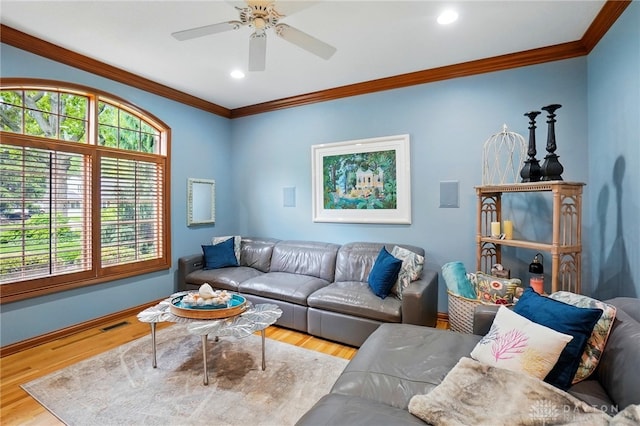 1129 Green Tree Rd, Centerville, OH 45429 - living area featuring crown molding, wood finished floors, a ceiling fan, healthy amount of natural light, and baseboards