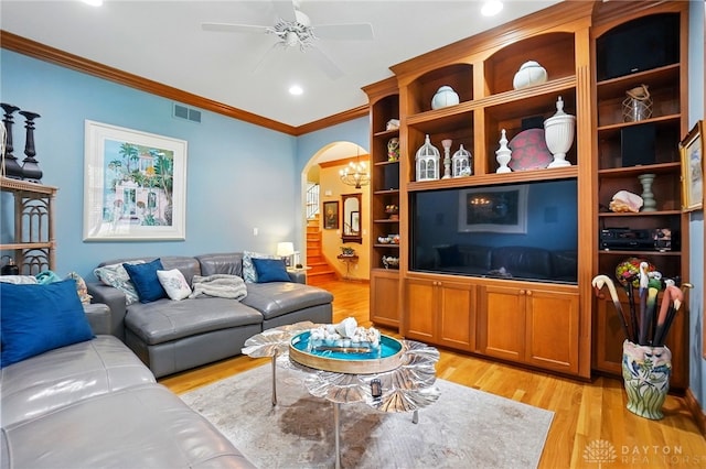 1129 Green Tree Rd, Centerville, OH 45429 - living room with light wood finished floors, crown molding, a ceiling fan, arched walkways, and recessed lighting