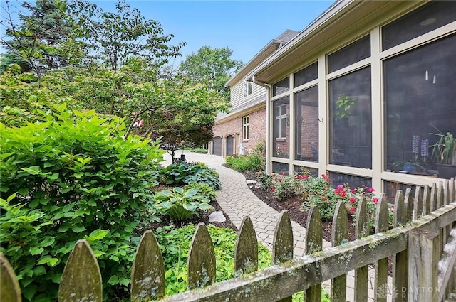 1129 Green Tree Rd, Centerville, OH 45429 - view of side of property featuring a sunroom and brick siding