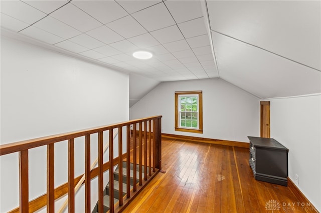 1012 W Sparrow Rd, Springfield, OH 45502 - additional living space with baseboards, wood-type flooring, and vaulted ceiling