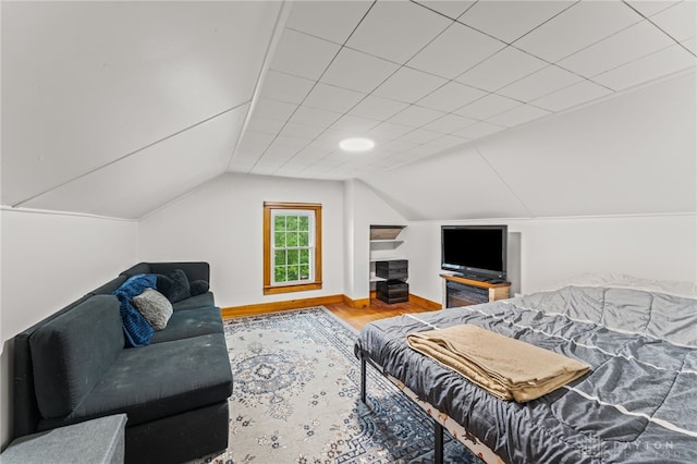 1012 W Sparrow Rd, Springfield, OH 45502 - bedroom featuring wood finished floors, lofted ceiling, and baseboards
