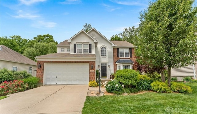 1422 Shawnee Run Dr, Maineville, OH 45039 - traditional-style house with concrete driveway, an attached garage, brick siding, and a front yard