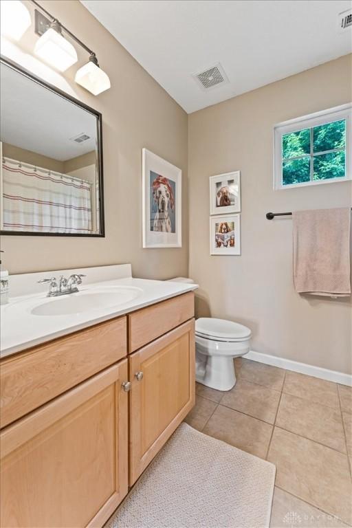 1422 Shawnee Run Dr, Maineville, OH 45039 - bathroom with vanity, tile patterned floors, toilet, and baseboards