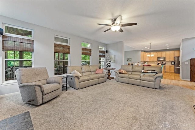 1422 Shawnee Run Dr, Maineville, OH 45039 - living room with light carpet, a ceiling fan, and healthy amount of natural light