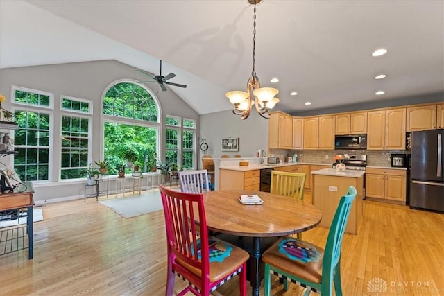 1422 Shawnee Run Dr, Maineville, OH 45039 - dining area featuring ceiling fan, lofted ceiling, light wood-style floors, a chandelier, and recessed lighting