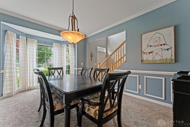 1422 Shawnee Run Dr, Maineville, OH 45039 - dining room featuring carpet floors, ornamental molding, wainscoting, and stairs