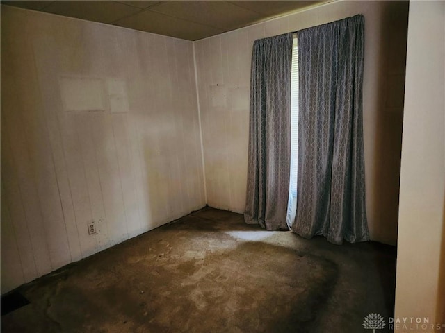 211 Nordale Ave, Dayton, OH 45420 - spare room featuring carpet flooring and wooden walls