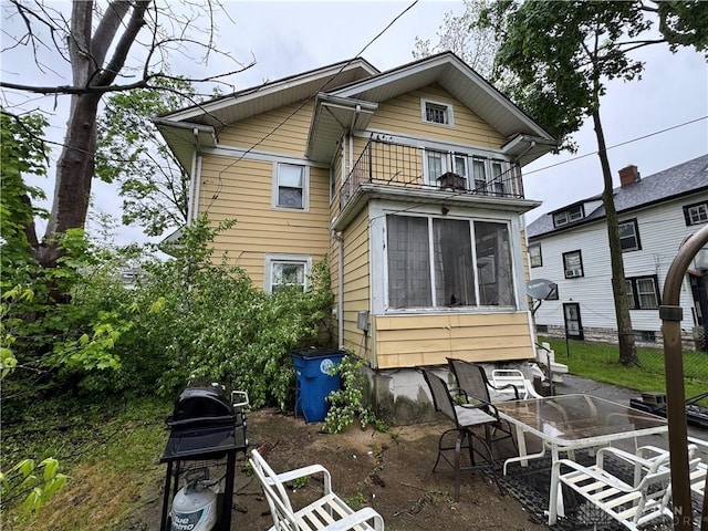 1606 W Grand Ave, Dayton, OH 45402 - back of property featuring a patio area and a sunroom