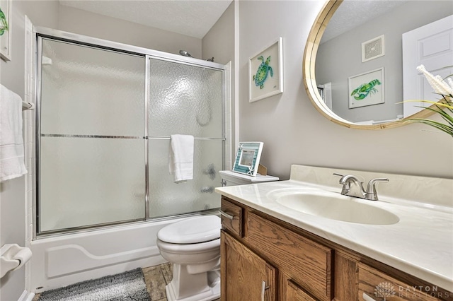 1690 Piper Ln Unit 206, Washington Twp, OH 45440 - full bath featuring vanity, toilet, enclosed tub / shower combo, and a textured ceiling