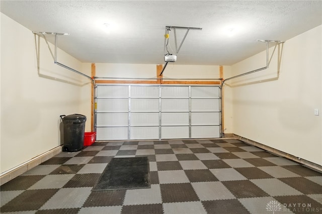 641 Angler Ct, Beavercreek, OH 45430 - garage with a garage door opener and baseboards